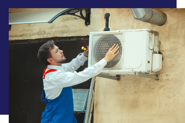 HVAC worker adjusting an AC